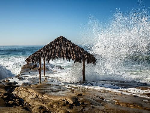 USA-California-La Jolla High surf at high tide inundates Windansea Surf Shack Coastal Print